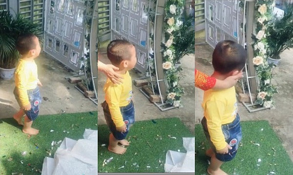 Khi được gọi ra chụp ảnh chung, bé trai nhất định không đồng ý khiến người nhà hết cách.