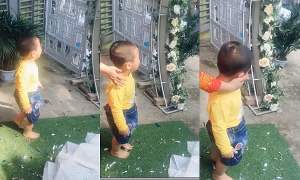 Khi được gọi ra chụp ảnh chung, bé trai nhất định không đồng ý khiến người nhà hết cách.