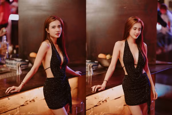 Trang phục chất liệu mỏng nhẹ với khoảng hở ở ngực, lưng và hai bên hông giúp em gái Công Vinh tôn thân hình cực quyến rũ.