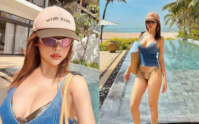 Huyền Baby lựa chọn áo tank-top dạng bikini màu xanh dương, kết hợp với quần bơi tông màu trung tính tạo nên sự hài hòa về màu sắc và tôn lên vóc dáng đẹp hút mắt.