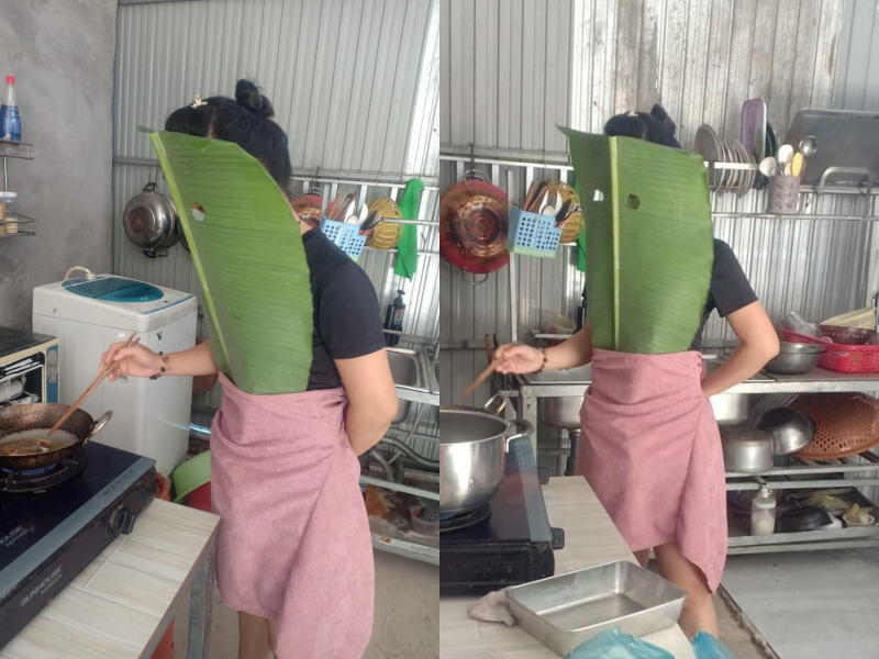 Không chỉ bảo hộ vùng trên cơ thể, người phụ nữ này còn lấy khăn quấn chân để tránh dầu nóng bắn vào.