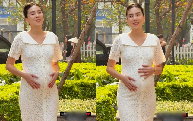 Mẹ bầu Mai Ngọc khoe nhan sắc xinh đẹp, đằm thắm. Cô tự tin diện váy ôm sát body khi đang mang bầu ở tháng thứ 8.