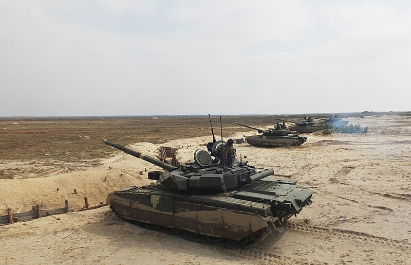 Tuyên bố này được được ra sau khi xảy ra sự việc một chiếc xe tăng T-84 Oplot sau khi khởi động rung bần bật tại cuộc thi Strong Europe Tank Challenge 2018 được tổ chức tại Đức tập trung dàn xe tăng các nước NATO và thân NATO. Nguồn ảnh: Wikipedia