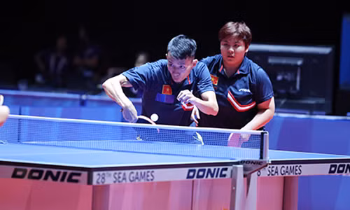 Quang Linh và Mỹ Trang chắc chắn giành huy chương thứ hai cho Đoàn TTVN. Ảnh: Đức Cường.