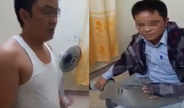 Hình ảnh ông Q. liên tục thay áo khi bị bắt quả tang vào nhà nghỉ cùng vợ người khác. Ảnh cắt từ clip.