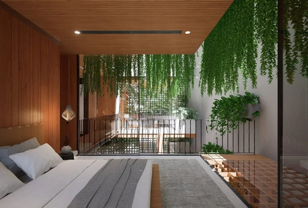 Cây xanh bố trí khắp các khu vực trong công trình, từ mặt tiền đến vườn treo giữa nhà. Ảnh: Tran Trung Architects