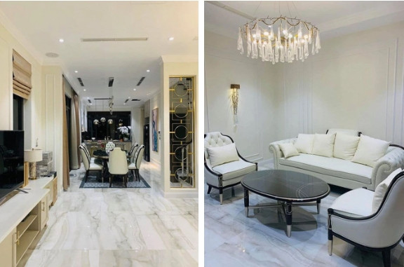 Bên trong, phòng khách rộng rãi, bài trí thêm bộ sofa trắng ngà điểm thêm chiếc đèn trần lộng lẫy có ánh vàng làm tăng vẻ sang trọng. Ảnh: FB Nguyễn Thanh Vân