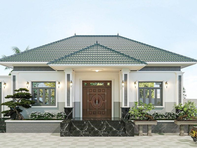  Nhà mái Nhật 1 tầng nổi bật với tông xanh rêu, trắng và vẻ đẹp cân đối của mặt tiền. Ảnh: Alonhaxinh