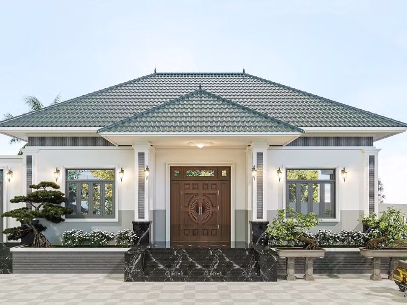  Nhà mái Nhật 1 tầng nổi bật với tông xanh rêu, trắng và vẻ đẹp cân đối của mặt tiền. Ảnh: Alonhaxinh