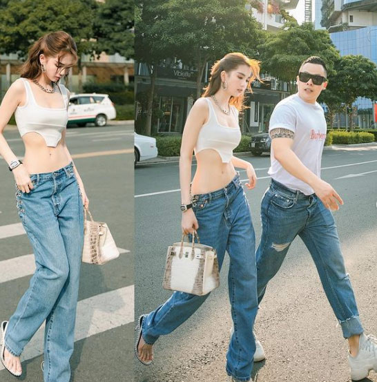 Quần jeans cạp trễ, áo crop top, thời trang đường phố của Ngọc Trinh khiến ai cũng phải ngoái nhìn.