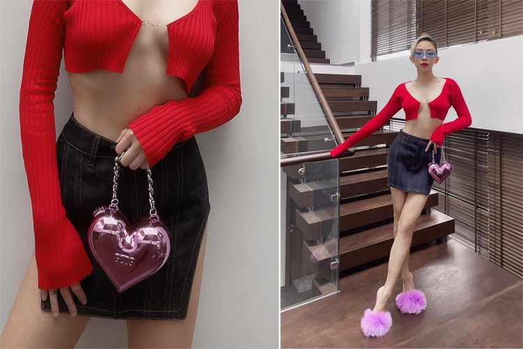 Áo len đỏ che ngực hờ hững, chân juyp đen xẻ tà cao, Tóc Tiên nóng bỏng tới mức người xem không thể rời mắt.