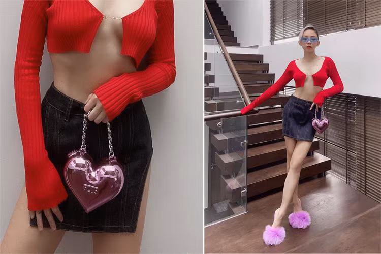 Áo len đỏ che ngực hờ hững, chân juyp đen xẻ tà cao, Tóc Tiên nóng bỏng tới mức người xem không thể rời mắt.