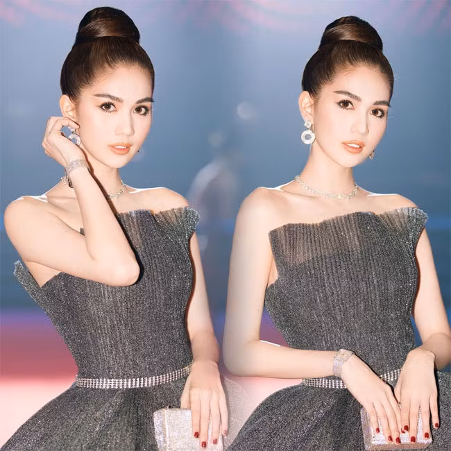 Tương tự như thế, chiếc váy màu xám của Ngọc Trinh lại được cô mix với phụ kiện là đồ hồ màu ghi tiệp màu với cả váy lẫn xắc tay.