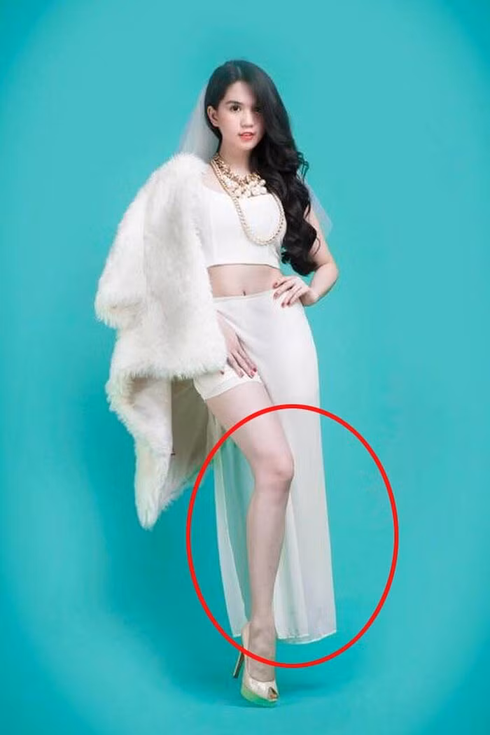 Trong khoảnh khắc hóa thân thành cô dâu, "nữ hoàng nội y" Ngọc Trinh cũng rơi vào trường hợp tương tự khi chân bên trái biến đâu mất tiêu!