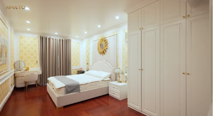 Phòng ngủ master trên tầng 2 sử dụng gam màu trắng chủ đạo, tạo cảm giác thư thái, nhẹ nhàng.