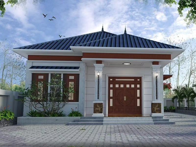 Nhà cấp 4 mái Nhật hiện đại với các trụ lớn và cửa gỗ làm điểm nhấn. Ảnh: Xaynhadeponline