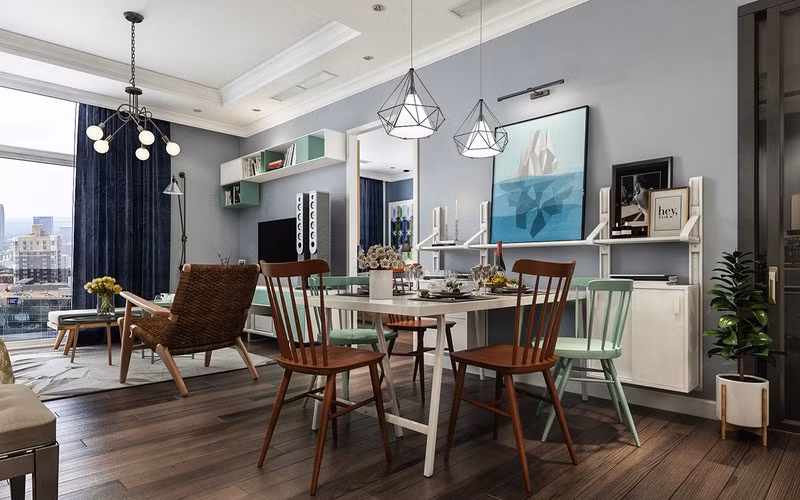 Bộ bàn ghế ăn đặt cạnh phòng khách. Ghế ăn được gia chủ sử dụng màu sắc trẻ trung, hiện đại để phù hợp với sở thích của các thành viên trong gia đình.