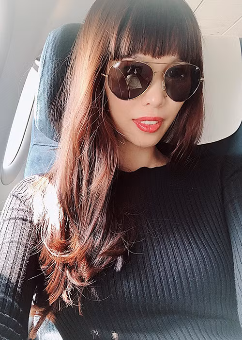 Bà bầu Hà Anh đáp chuyến bay đi Hong Kong.