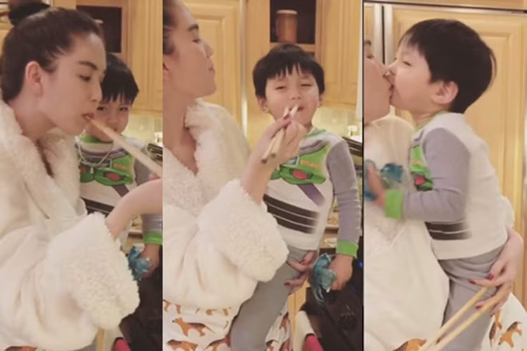 Không chỉ được lòng các con ông Hoàng Kiều, Ngọc Trinh còn được các cháu của bạn trai rất quý mến. Trong ảnh, nữ diễn viên phim “Vòng eo 56” bồng bế, âu yếm một cháu trai của vị tỷ phú. (Ảnh: Vietnamnet) 