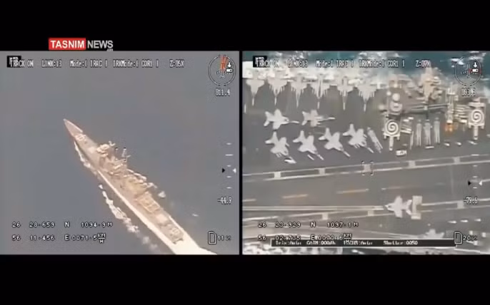 Cận cảnh hình ảnh khu trục hạm của Mỹ hộ tống tàu sân bay và các chiến đấu cơ trên hàng không mẫu hạm Mỹ hoạt động ở vùng Vịnh Ba Tư được các máy bay không người lái của Iran ghi lại. Nguồn ảnh: TASNIM.