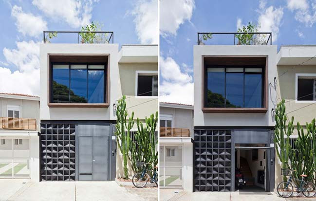 Nhà phố 2 tầng kết cấu hình khối, sử dụng kết hợp vật liệu kính, sắt. Ảnh: Kientrucsuvietnam.