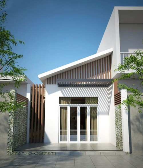 Mái lệch giúp che đi phần mái tôn của căn nhà mà vẫn mang lại nét đẹp sang trọng. Ảnh: Vtkong.