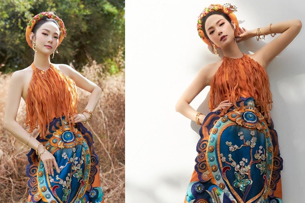 Thay vì chọn áo dài như những ngôi sao khác, Minh Hằng diện chiếc váy cổ yếm để khoe dáng ngọc trong bộ ảnh tiễn năm Canh Tý, chào đón năm Tân Sửu.