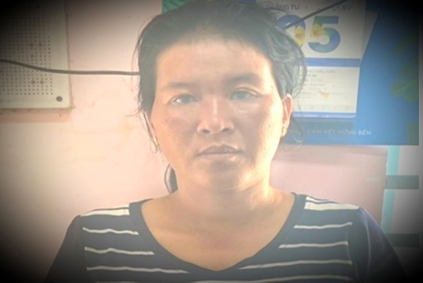 Nữ xe ôm Thái Thị Bích Hạnh khi vừa bị bắt khẩn cấp. (Ảnh: Nld)