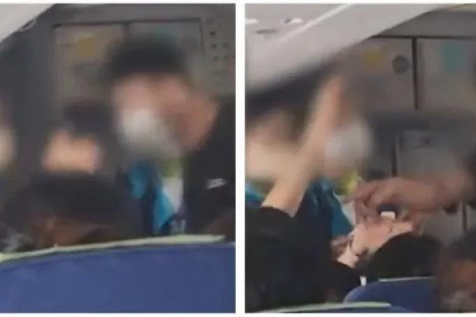 Nguoi dan ong chui boi khach nu de con khoc tren may bay