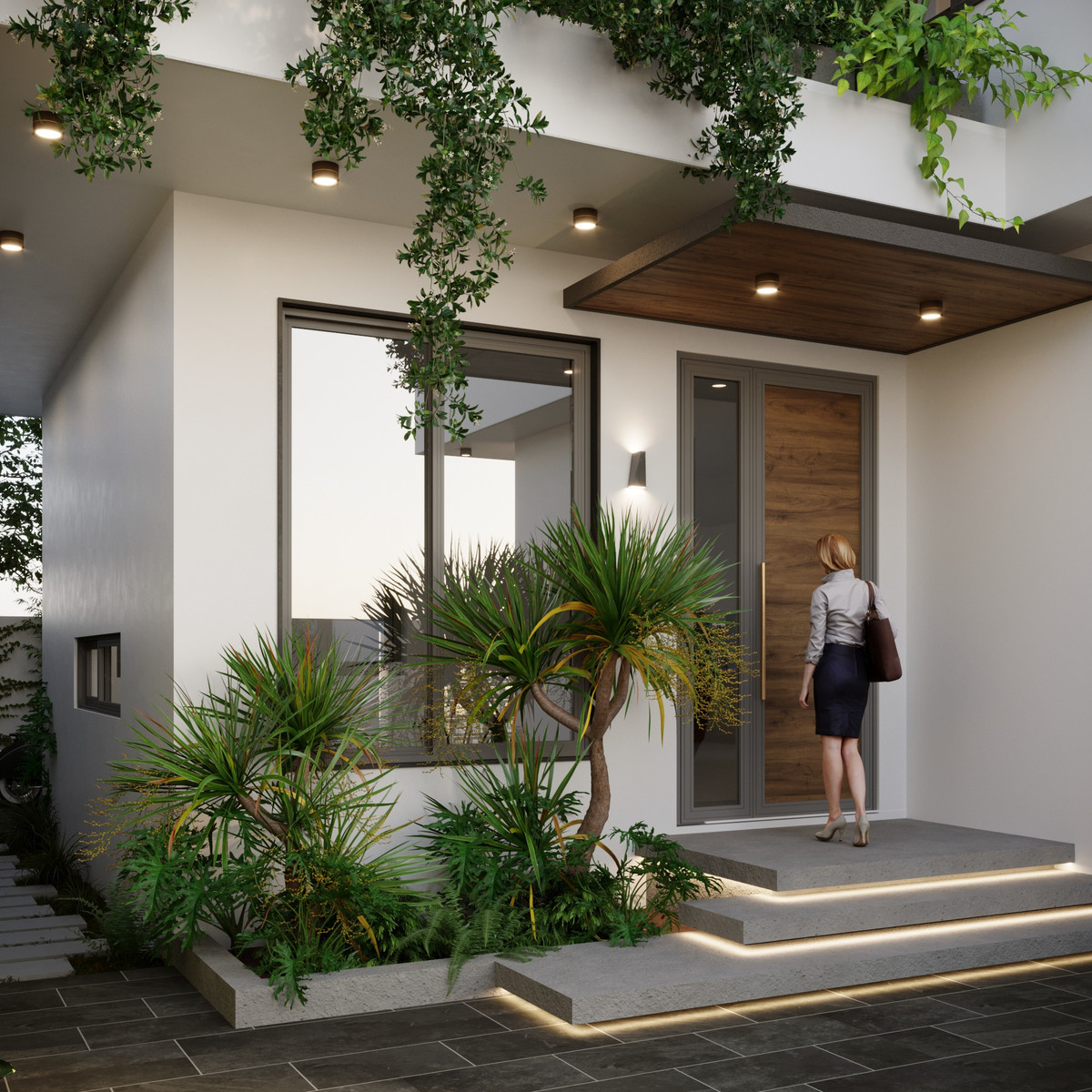 Sảnh vào nhà đơn giản, bồn cây phía ngoài kết hợp với hàng cây rủ phía trên vừa để trang trí vừa giúp tăng sự riêng tư cho khu vực phòng khách. Sinh hoạt trong phòng khách sẽ thoải mái hơn mà không cần phải kéo rèm.