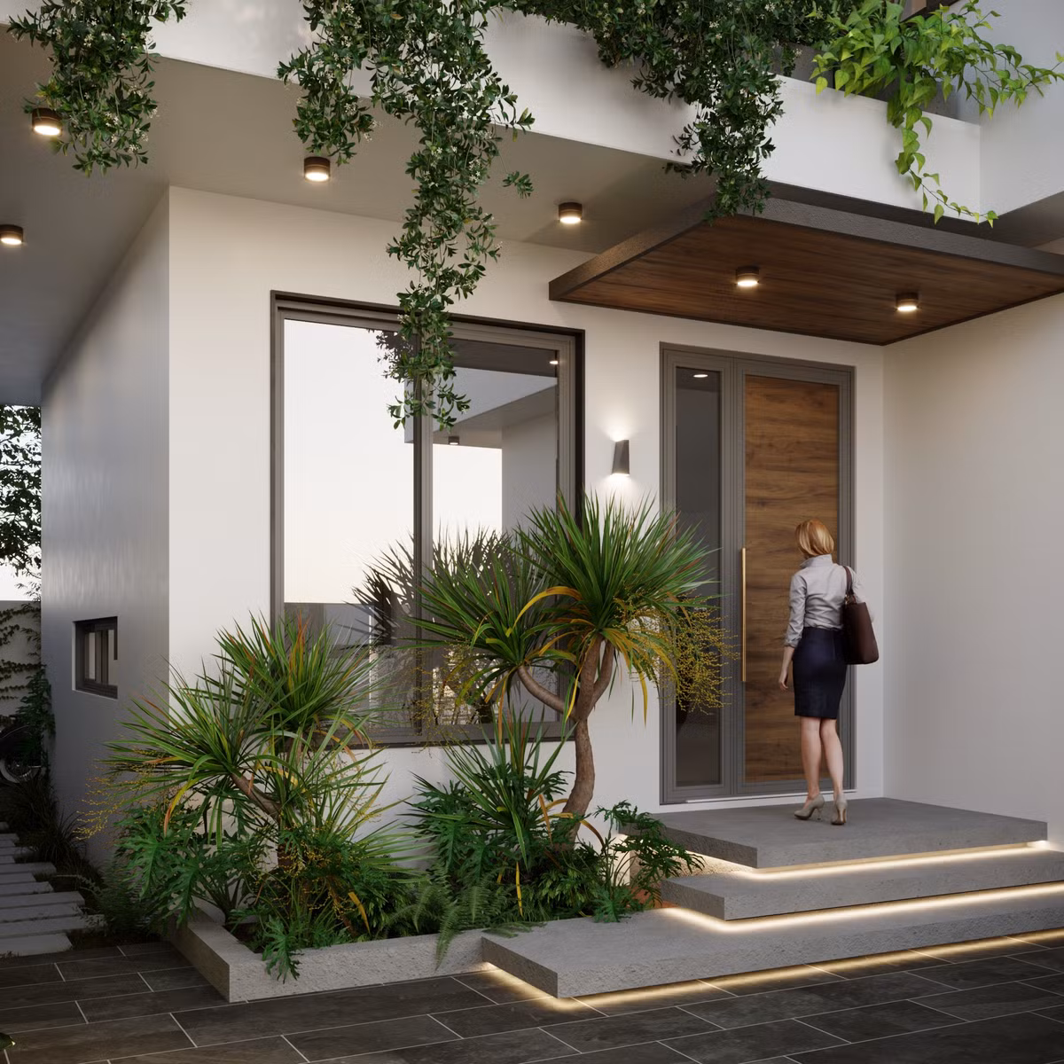 Sảnh vào nhà đơn giản, bồn cây phía ngoài kết hợp với hàng cây rủ phía trên vừa để trang trí vừa giúp tăng sự riêng tư cho khu vực phòng khách. Sinh hoạt trong phòng khách sẽ thoải mái hơn mà không cần phải kéo rèm.