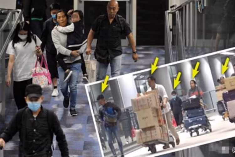 Gần đây, Thiên vương Hong Kong huy động đến 12 quản lý, vú em để hộ tống vợ con ở sân bay. Ảnh: Sohu