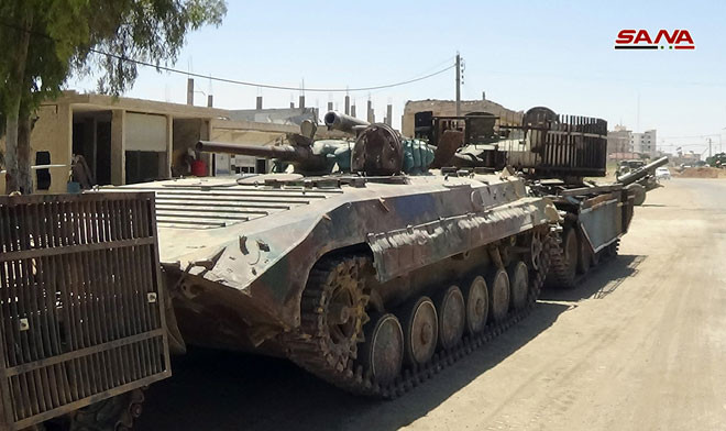 Được biết, các nhóm vũ trang của FSA ở Daraa bắt đầu giao nộp vũ khí cho Quân đội Syria vào ngày 14/7. Ảnh: SANA.