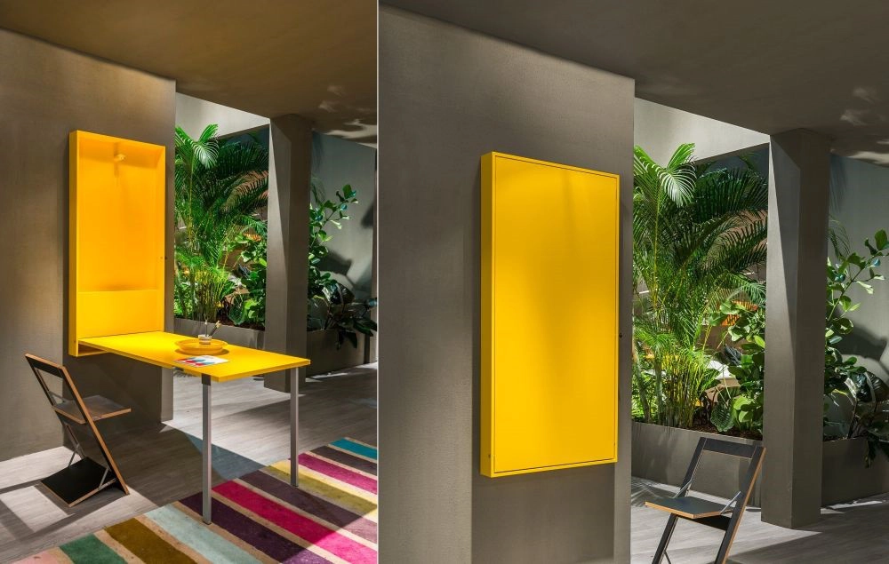 5. Một lựa chọn tuyệt vời khác nhiều màu sắc hơn cho nội thất nhà bạn chính là mẫu bàn Wally nhỏ gọn với phần mặt bàn gập xuống được. Bàn khá đơn giản, hiện đại và có hai chân kim loại.