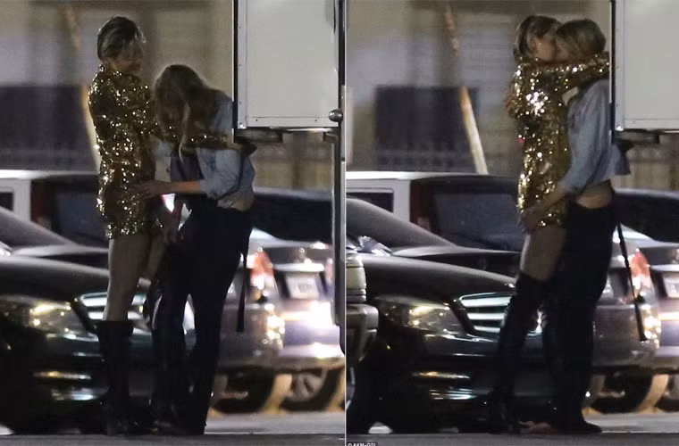 Vừa hôn nhau, họ vừa thì thầm gì đó rất tình tứ. Cả hai đều biết có ống kính paparazzi chĩa vào mình nhưng họ mặc kệ và tự nhiên âu yếm nhau như chốn không người.