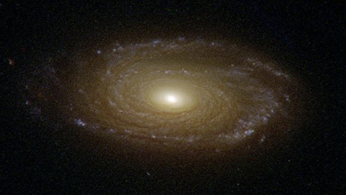 Tia phản lực phát ra từ lỗ đen có thể ngừng quá trình hình thành sao, giống như đã xảy ra với thiên hà 2MASX J23453268−0449256. (Ảnh: Mashable)