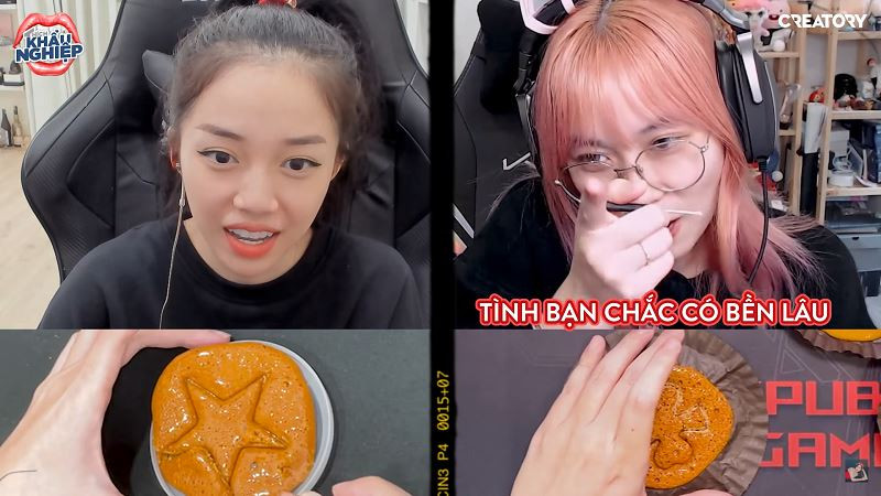 Hình trong kẹo được hai nữ streamer nhận được trong thử thách là hình ngôi sao và cỏ ba lá. Thay vì dùng kim như trong phim, Linh Ngọc Đàm và MisThy hài hước khi sử dụng tua - vít và dao rọc giấy để tách phần kẹo Dalgona.