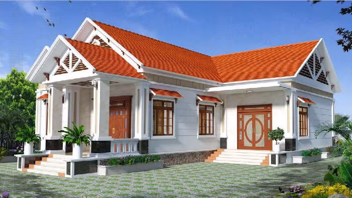 Nhà cấp 4 mái thái chữ L với không gian cây xanh bao quanh mang đến cảm giác bình yên. Ảnh: Internet