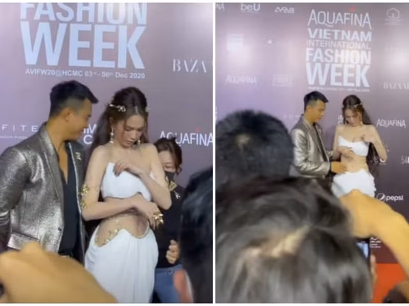 Ngọc Trinh chỉnh sửa trang phục ngay trên thảm đỏ. Hành động này gây tranh cãi.