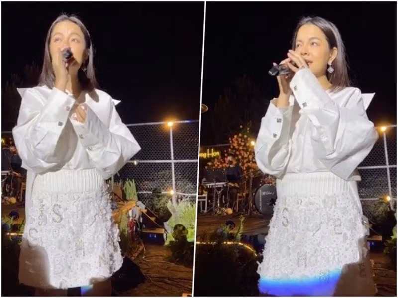 Diện set trang phục trắng đi hát, cô lộ eo bánh mì. Ảnh: Sức khỏe và đời sống