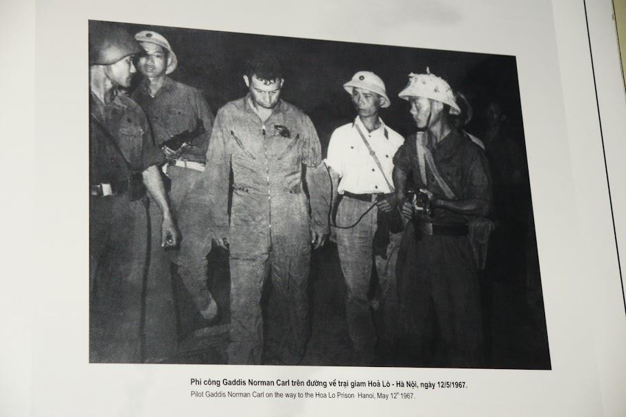 Trớ trêu thay, chiếc máy bay bị bắn rơi đó mang BN-63-7614 do chính Norman điều khiển. Tay giáo viên này đã nhanh tay nhảy dù, may mắn hơn hoa tiêu của mình - người đã thiệt mạng cùng chiếc tiêm kích. Ngay sau khi hạ xuống đất bằng dù, Norman được đưa tới nhà tù Hỏa Lò. 