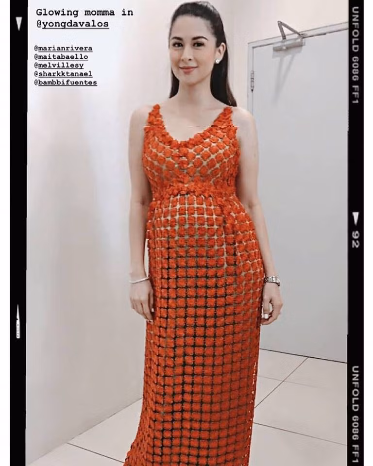 Marian Rivera diện chiếc váy màu cam nổi bật.