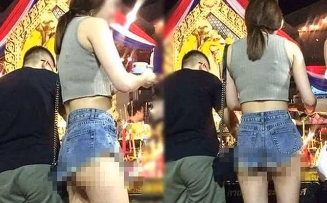 Thay vì những trang phục kín đáo, trang trọng thì cô gái này lại diện chiếc quần ngắn cũn cỡn, rất không phù hợp khi đi lễ chùa. Ảnh: Gia đình &amp; Xã hội.