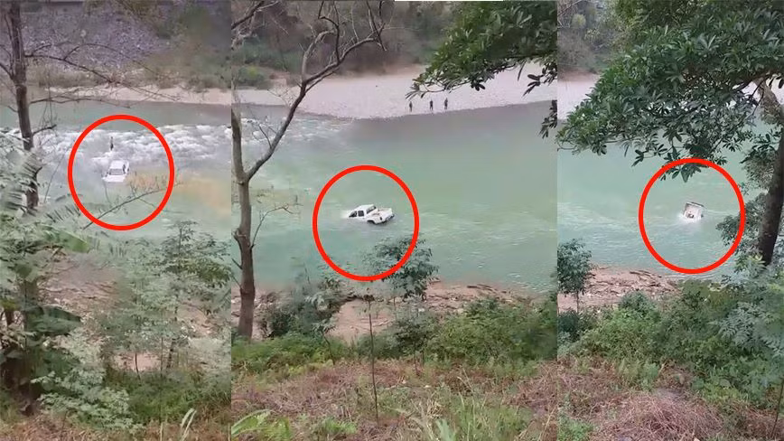 Xe o to ban tai bi nuoc suoi cuon troi, hai nguoi thoat chet