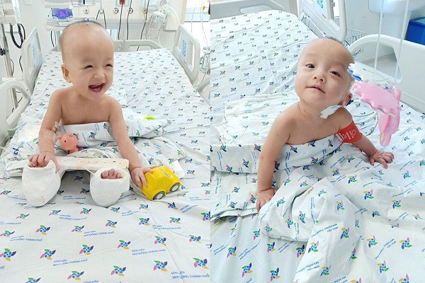 Hai be song Nhi co the ngoi day choi dua sau mot thang mo tach