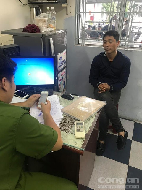 Hoàng Quốc Tuấn làm việc với cơ quan điều tra sau khi bị bắt.