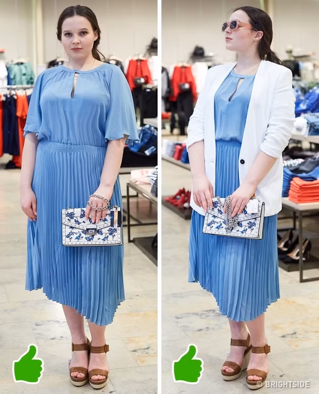 Một chiếc váy dài đơn sắc kết hợp với áo khóc vest dài sẽ giúp bạn trông nhỏ gọn hơn rất nhiều. Ngoài ra, việc xắn tay áo lên một chút cũng giúp bạn trông trông mảnh mai hơn. Ảnh: BS.