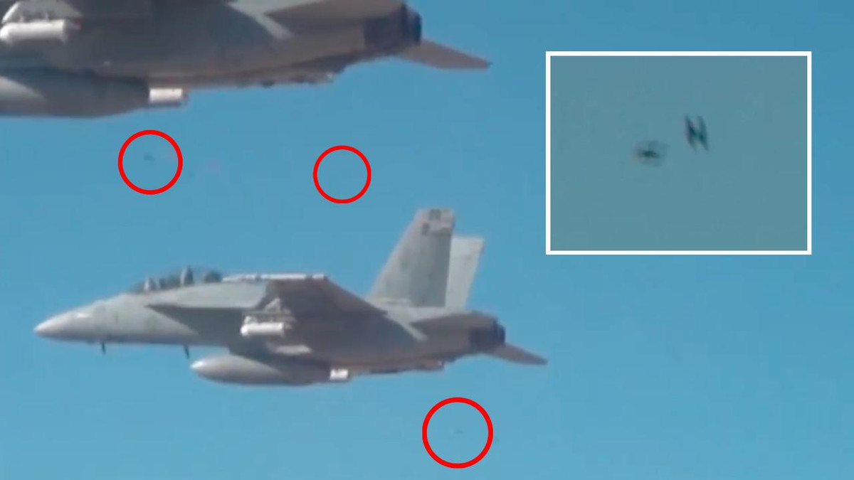 Tiếp đến, đầu năm 2017, Văn phòng Tiềm năng Chiến lược Quốc phòng và Lực lượng Không quân của Hải quân Mỹ đã cùng thử nghiệm dùng 3 máy bay chiến đấu F/A-18 mang theo 103 máy bay không người lái Perdix tham gia diễn tập. Trong dấu tròn đòn là những UAV mini được thả ra từ tiêm kích F/A-18 của Hải quân Mỹ trong thử nghiệm. Nguồn ảnh: Sina.