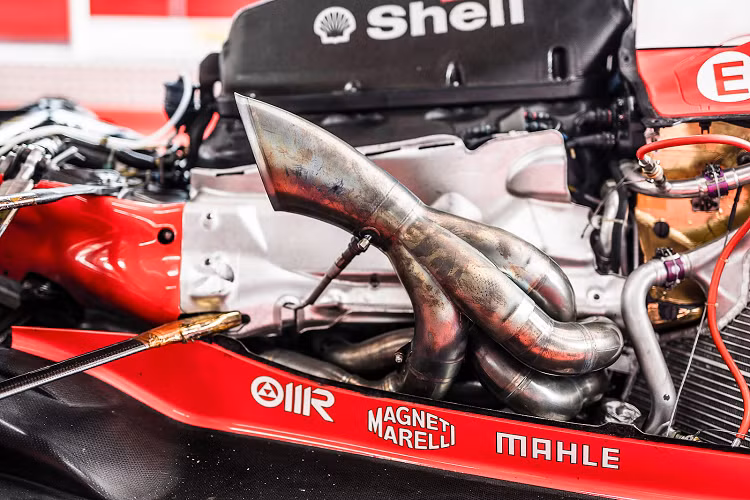 Ferrari đã giới thiệu một gói nâng cấp lớn tại vòng thứ năm của giải vô địch năm 2003 ở Tây Ban Nha và gọi gói này là GA. GA trong tên được thêm vào như một dấu hiệu của sự tôn trọng đối với Gianni Agnelli, Giám đốc điều hành của Fiat, người đã qua đời vào tháng Giêng năm đó. Agnelli yêu thích Ferrari và sở hữu chiếc Testarossa Spider duy nhất do nhà máy sản xuất.