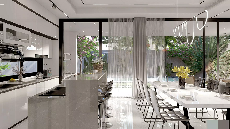 Bếp thiên về gam màu trắng sáng, thanh lịch, nhẹ nhàng. Thiết kế bếp hình chữ I giúp không gian phòng bếp trở nên thật rộng thoáng, đủ chỗ cho nhiều người cùng nấu nướng nếu như gia đình tổ chức tiệc hay vào các dịp lễ. Sàn nhà và mặt bếp được lát bằng gạch granite hiện đại trong khi tủ bếp bên dưới sử dụng gỗ. Đối diện bếp là quầy bar - nơi gia chủ có thể thưởng thức những bữa ăn phụ hoặc nhâm nhi tách cà phê vào buổi sáng. Nội thất giúp tăng cảm giác ấm áp cho căn phòng mà vẫn duy trì được sự hiện đại. Phòng khách, phòng bếp và phòng ăn được thiết kế thông với nhau mà không bị ngăn cách bởi tường hay bất kì thứ gì khác giúp cho không gian nhà trở nên rộng thoáng và có chiều sâu.